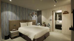 Llit o llits en una habitació de K HOTEL