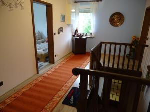 a hallway with a staircase and a door to a room at Ferien auf dem Land in Warstein