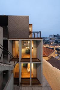 a room with a balcony and stairs leading up to a building at Oh! Porto Apartments in Vila Nova de Gaia