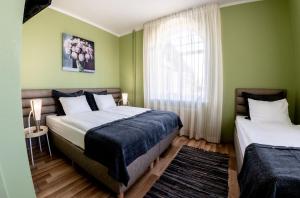Postel nebo postele na pokoji v ubytování Spa Hotel Ezeri