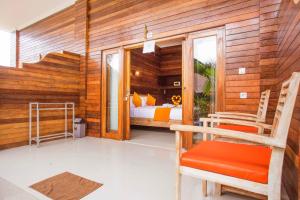 Ein Bett oder Betten in einem Zimmer der Unterkunft Dinatah Lembongan Villas