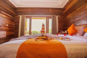 Ein Bett oder Betten in einem Zimmer der Unterkunft Dinatah Lembongan Villas