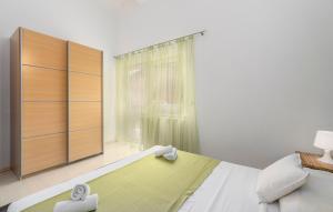 a bedroom with a bed and a large window at Maja Apartment 3 in Funtana