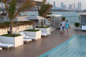 a rendering of the rooftop pool at the trumpilusilus dubai hotel towers at Jumeirah Burj Al Arab Dubai in Dubai