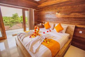 Ein Bett oder Betten in einem Zimmer der Unterkunft Dinatah Lembongan Villas