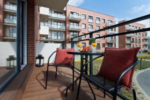 Balkón alebo terasa v ubytovaní NAP Apartments Długa Grobla + 16 fotografií