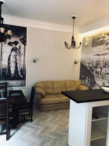 a living room with a couch and a table at VIP apartment history in Lviv