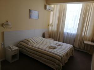 Postel nebo postele na pokoji v ubytování light hotel & hub