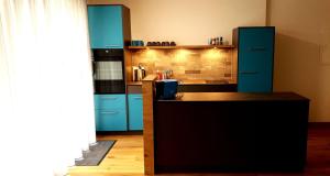 Kuchyň nebo kuchyňský kout v ubytování Loft4two