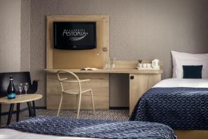 Postel nebo postele na pokoji v ubytování Astoria Hotel