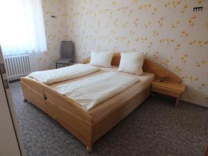Llit o llits en una habitació de Ferienwohnungen Hüning