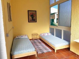 Postel nebo postele na pokoji v ubytování Casa Ananda