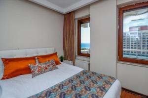 Postel nebo postele na pokoji v ubytování Lara Park Suites