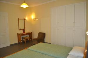 A bed or beds in a room at Holiday Studio Apartments yannis on the beach of Agios Gordios in Corfu