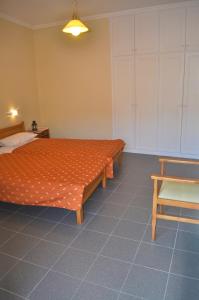 A bed or beds in a room at Holiday Studio Apartments yannis on the beach of Agios Gordios in Corfu