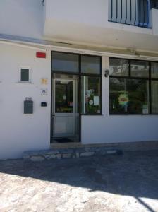 an entrance to a building with a door and windows at Monte Estrela in Sabugueiro