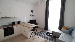 A kitchen or kitchenette at Piacsek Apartmanház