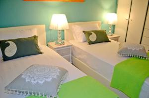 Кровать или кровати в номере Aloe house Lakithra