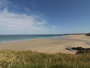 a view of a beach with the ocean in the background at The Beach Halt in Perranporth