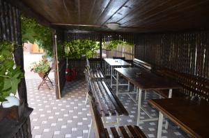 a row of tables and benches in a restaurant at SmartHouse in Costinesti