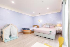 Kiwi Villa 객실 침대