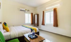 Itsy Hotels Riyas Grand客房内的一张或多张床位