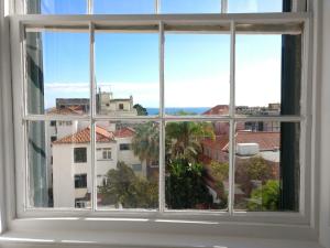 a window with a view of a city at Museum House in Funchal
