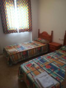 Postel nebo postele na pokoji v ubytování Complejo VACANZA-TURIS + 14 fotografií