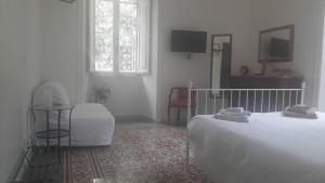 Postel nebo postele na pokoji v ubytování B&B Domus Aurea