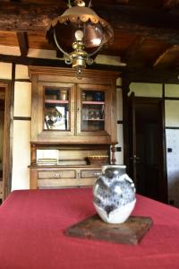 a vase sitting on top of a table at Yourte Roulotte et Gite de la Laïta in Clohars-Carnoët