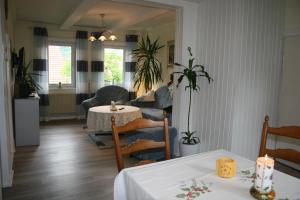 a living room with a table and a couch at Haus Christa in Langelsheim