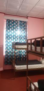 Postel nebo postele na pokoji v ubytování YMCA Tourist Hostel Shimla