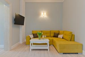 Televízia a/alebo spoločenská miestnosť v ubytovaní Imperial Apartments Helska