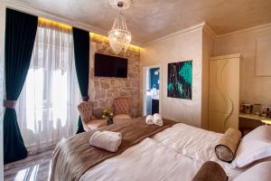 Posteľ alebo postele v izbe v ubytovaní Riva Palace - design rooms
