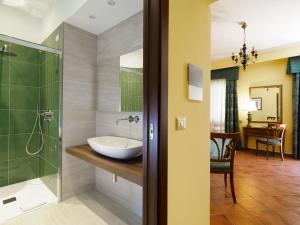 a bathroom with a sink and a shower at Hotel Sirius in Taormina