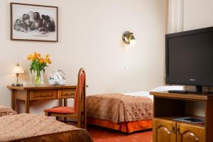 Postel nebo postele na pokoji v ubytování Hotel Regent