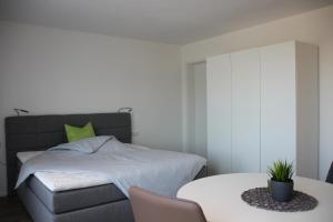 מיטה או מיטות בחדר ב-Rainer Appartements