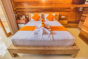 Ein Bett oder Betten in einem Zimmer der Unterkunft Dinatah Lembongan Villas