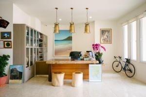 a home office with a desk and a bike at He Sen B&B in Kenting