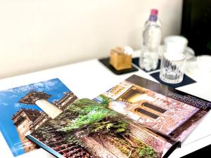 a book sitting on top of a table at Bue Nero Suites Verona in Verona