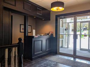 a lobby with a door leading to a restaurant at Skyline Motel in Fredericton