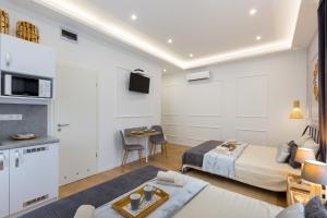 a hotel room with two beds and a kitchen at Budapest Holidays Residence in Budapest