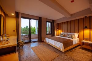 Postel nebo postele na pokoji v ubytování Arwen Hotel