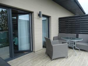 Posedenie v ubytovaní Apartament z widokiem na morze - Apartament Turkusowy