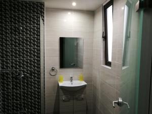 a bathroom with a sink and a mirror at Golden days in Afantou +33 photos