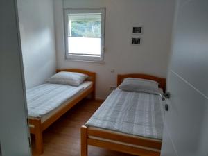 Un pat sau paturi într-o cameră la Hvar Apartment