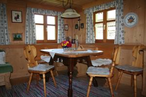 a dining room with a table and two chairs at Haus Schnetzer in Schruns