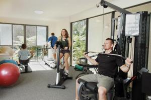 a man in the gym with a microphone at Flynns Beach Resort in Port Macquarie