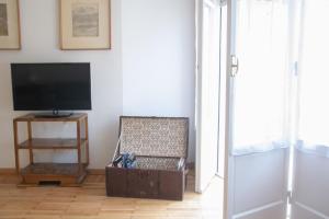 A television and/or entertainment centre at Casa Brunetta - WelcHome