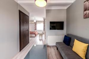a living room with a couch and a table at Masal Apart in Istanbul